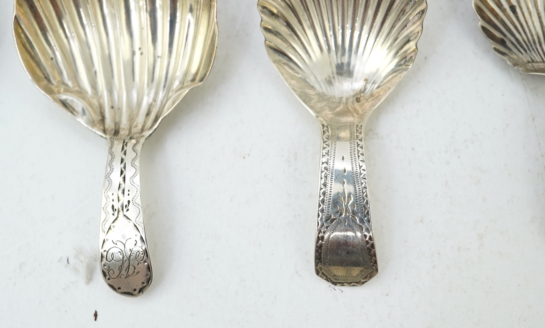Ten assorted mainly 19th century silver and white metal caddy spoons, with shell or fluted bowls